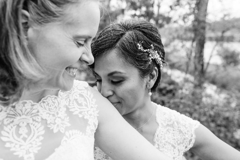 Tender kiss and moment between same sex partners at LGBT wedding in New Hope PA by Kasey Ivan Photography