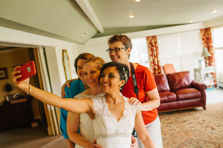 brides take a selfie with friends before a same sex lesbian wedding at the 1740 House by Kasey Ivan Photography