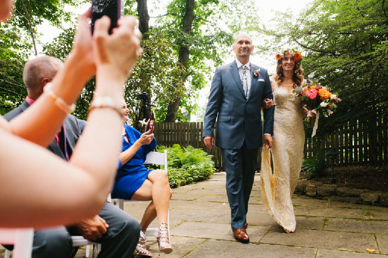 bride and groom walk down the aisle together at a summer Italian wedding ceremony at the Black Bass Hotel outside New Hope PA by Kasey Ivan Photography