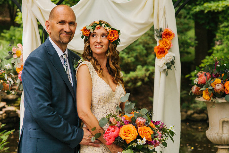 bride and groom pose for summer wedding portraits in the woods by Kasey Ivan Photography outside the Black Bass Hotel near New Hope PA