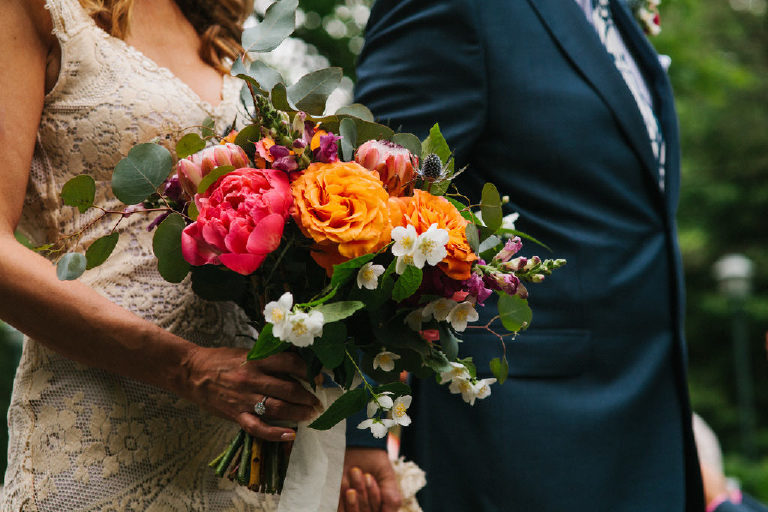 bride holding bouquet of summer flowers by Lauren Kiernan of Flora in Lambertville NJ