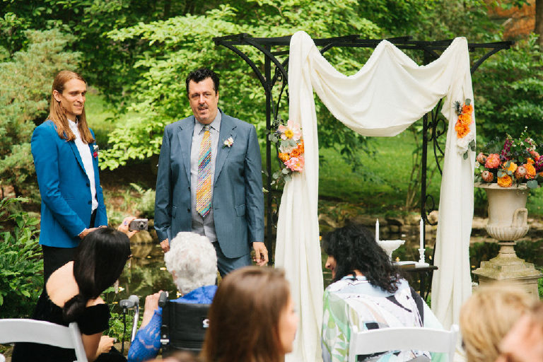 brother and son of the bride await for her to arrive at an Italian summer wedding at the Black Bass Hotel outside New Hope PA
