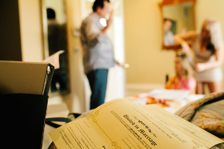 Blank Pennsylvania marriage certificate with bride getting ready for wedding in background