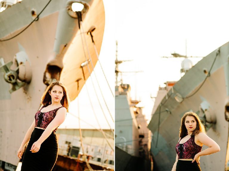 Senior girl striking a powerful pose in the navy shipyard in philadelphia