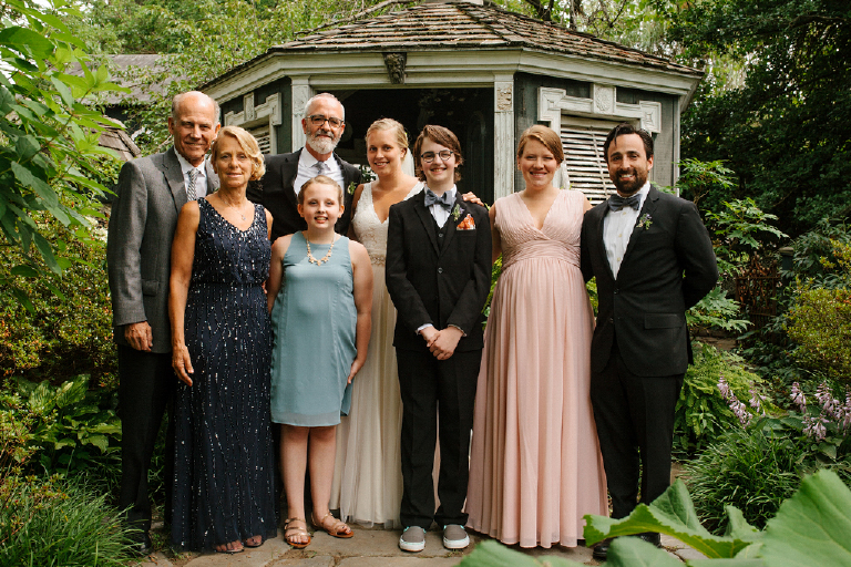 Group Picture of a family with the bride and groom in a garden in the porches in the towpath in New Hope and Lambertville