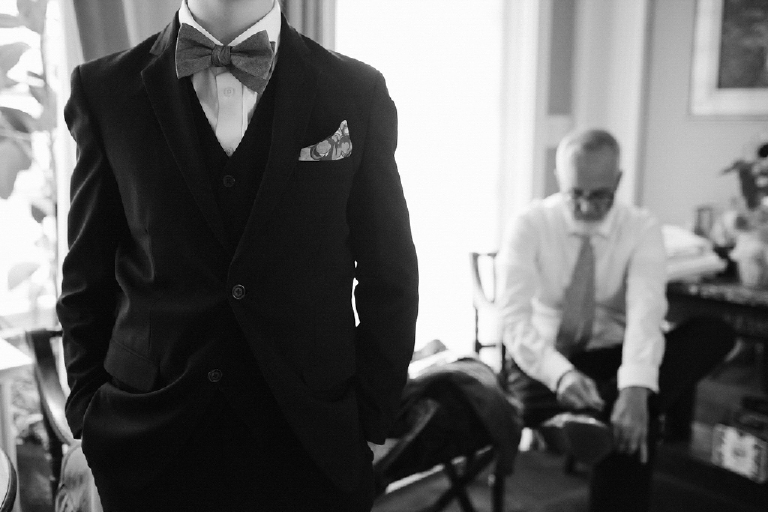 Black and white picture of a tux with a bow tie getting dressed for a wedding in New Hope