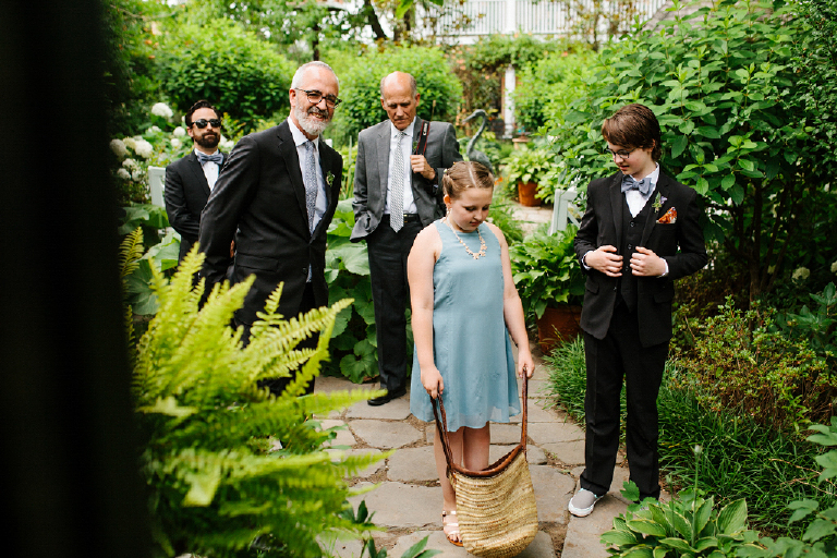 Groom standing in the harden of the Porches on the Towpath in New Hope and Lambertville with his chldren waiting for the wedding 