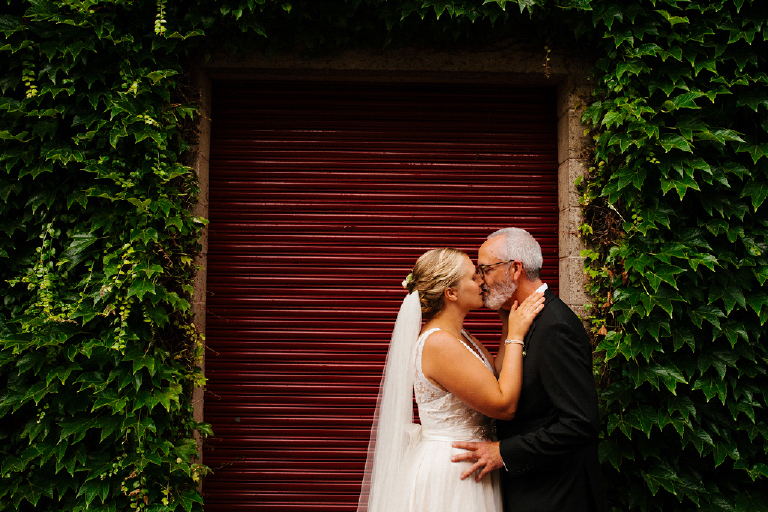 New Husband and Wife kissing at Hamiltons Grill Room
