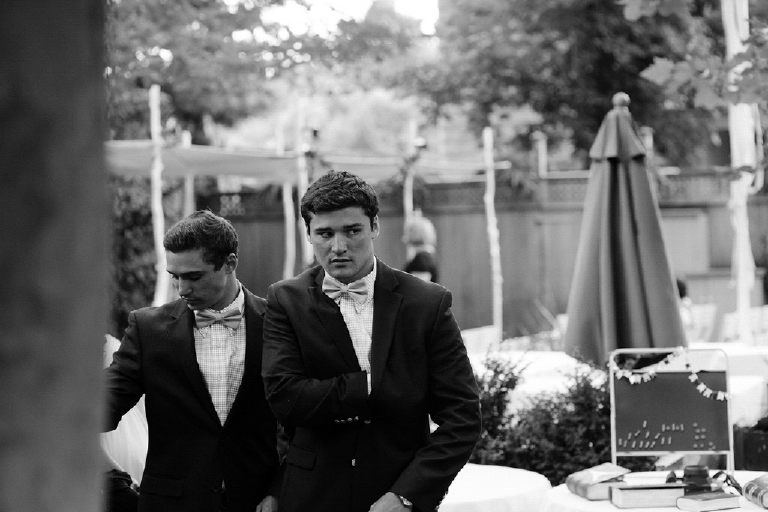 Black and white photograph of a man in a tux at a wedding at Hamiltons Grill Room Lambertville