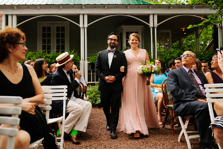 Bridesmaid and groomsman walking down the aisle at a wedding at Hamilton's Grillroom Lambertville New Hope