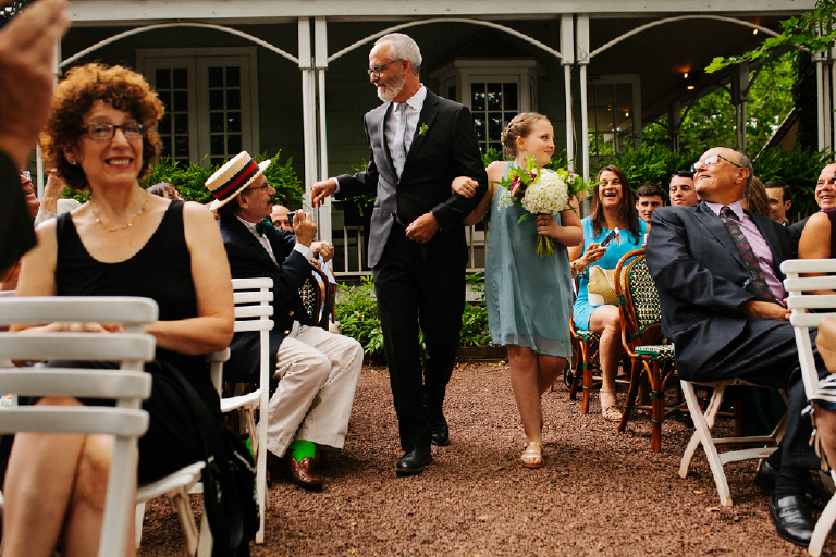 Groom walking down the aisle with his daughter holding colorful bouquet of flowers Hamilton's Grillroom Lambertville New Hope