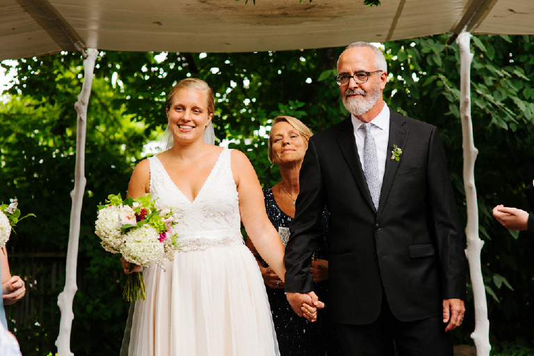 New Wife and Husband holding hands waling down the aisle at teir wedding Hamilton's Grillroom Lambertville New Hope