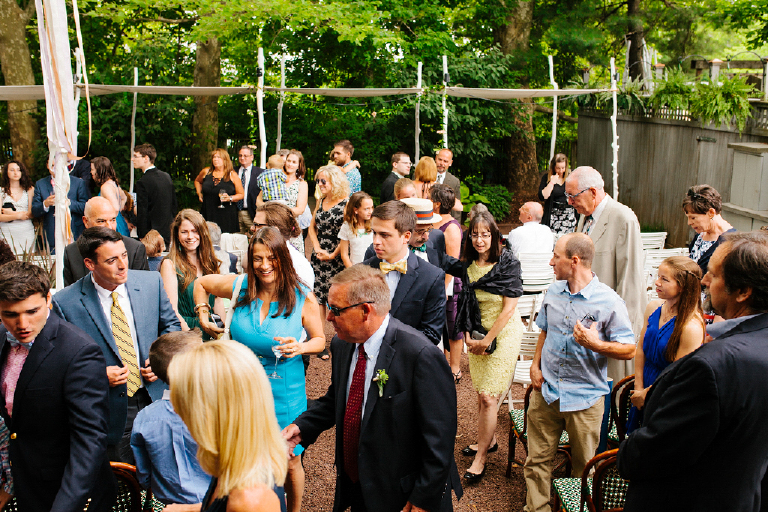 Wedding guests standing and talking after wedding ceremony Hamilton's Grillroom Lambertville New Hope