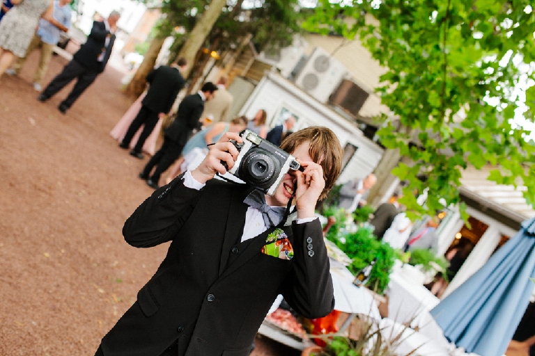 Photography of a girl with a old polaroid camera at a wedding Hamilton's Grillroom Lambertville New Hope