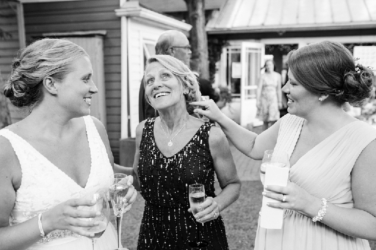 Picture of Bride with her family with drinks celebrating her wedding at Hamilton's Grillroom Lambertville New Hope