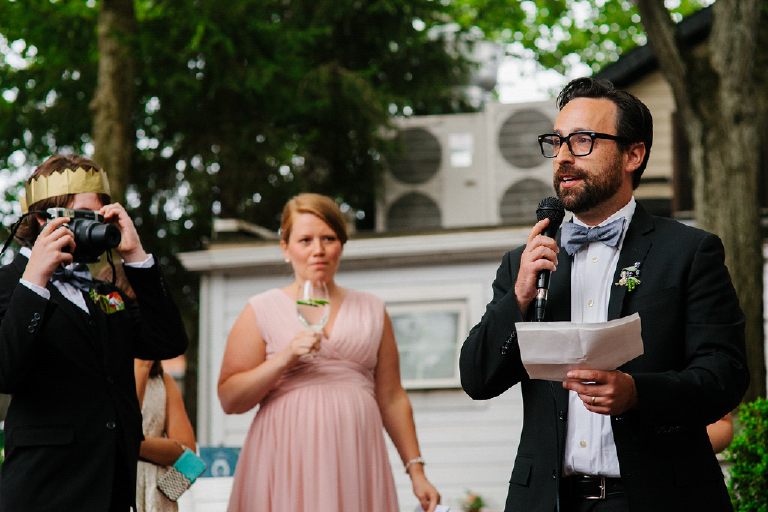 Best man giving speach at his friends wedding with drink at Hamilton's Grillroom Lambertville New Hope