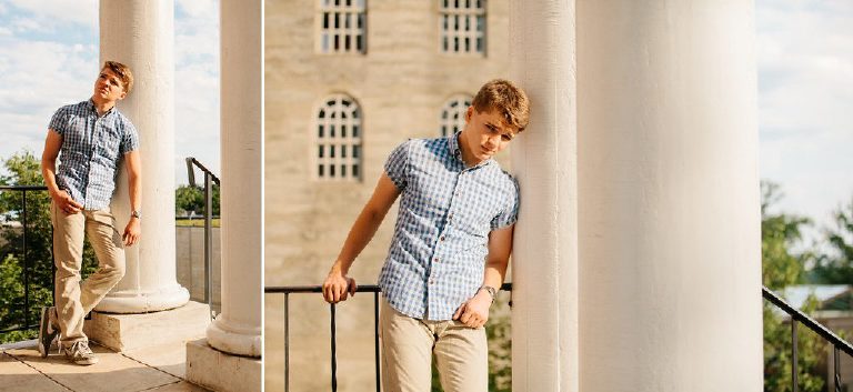 high school senior boy leans against pillars for senior pictures in Bucks County Pennsylvania by Kasey Ivan Photography