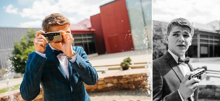 teenager posing with camera for GQ inspired senior photos in blue suit at Michener Museum in Doylestown Pennsylvania by portrait photographer Kasey Ivan Photography