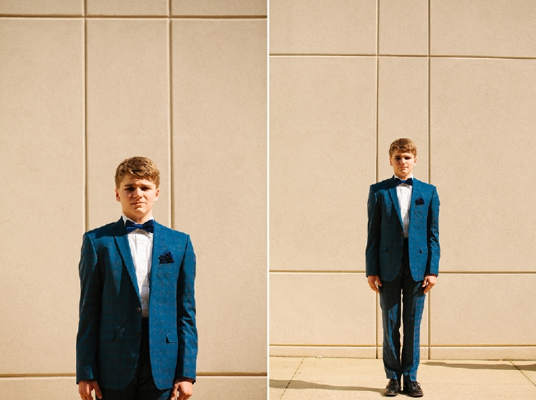 Tyler McClellan in Wes Anderson inspired senior photos wearing a blue tux in Doylestown Pennsylvania by Kasey Ivan Photography