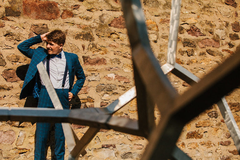 high school senior Tyler McClellan poses in inspired GQ photo shoot of senior pictures outside Doylestown Michener Museum by photographer Kasey Ivan