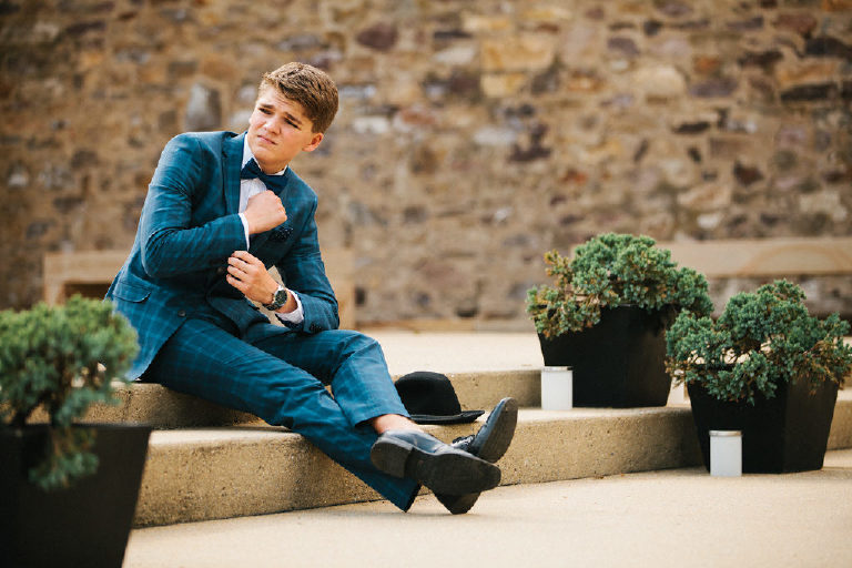 Tyler McClellan in fashion inspired senior photos high school student wearing blue suit at Michener Museum in Doylestown Pennsylvania by photographer Kasey Ivan Photography