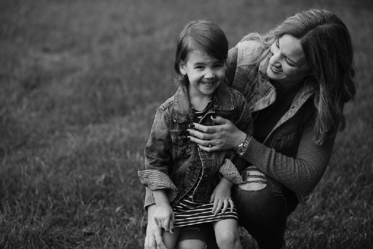 mother holding daughter for family portrait by New Hope photographer Kasey Ivan