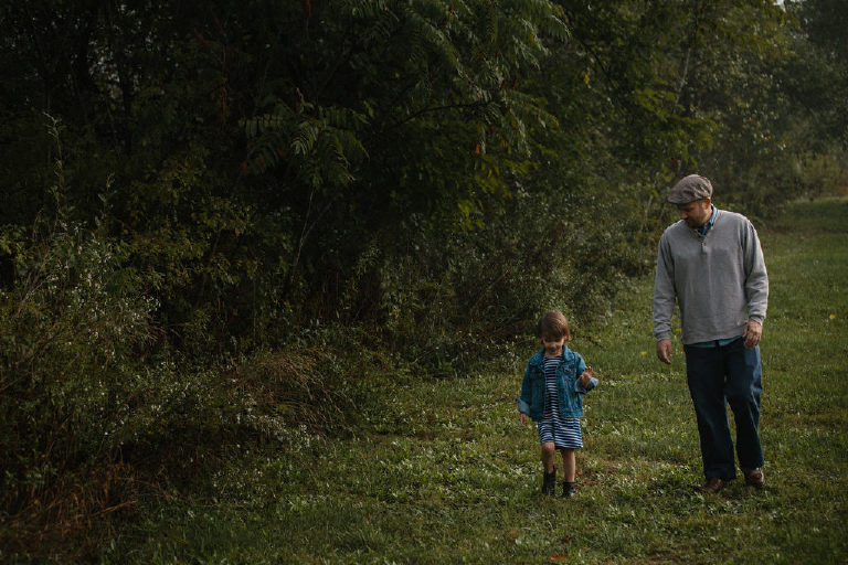 father walking with little girl in woods for family portrait by New Hope photographer Kasey Ivan