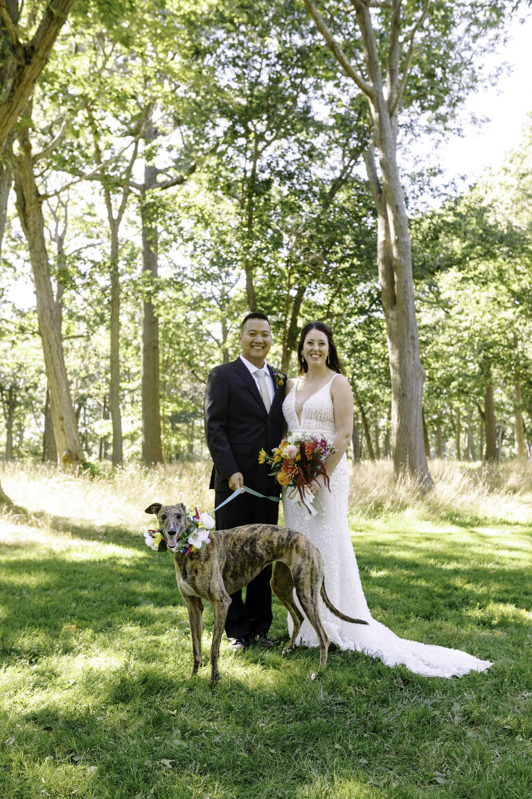 Wedding couple and their dog in Deering Oaks Park in Portland Maine