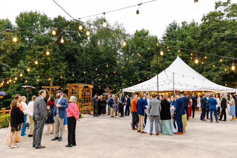 Cocktail hour guests mingling at a fall wedding at the Tarry A While Resort in Bridgton Maine