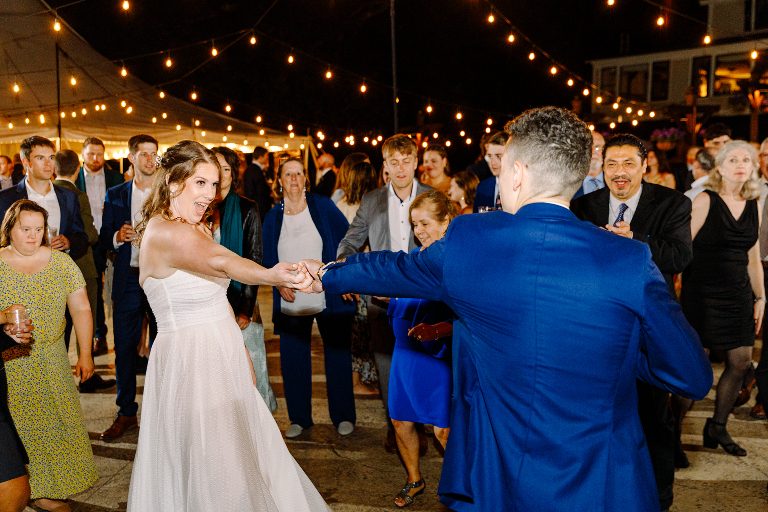 Bride and groom dance at their outside wedding reception at the Tarry A While Resort in Bridgton Maine by Kasey Ivan Photography
